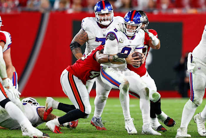 Nov 22, 2021; Tampa, Florida, USA; New York Giants quarterback Daniel Jones (8) is sacked by Tampa Bay Buccaneers linebacker Devin White (45) in the second half at Raymond James Stadium.